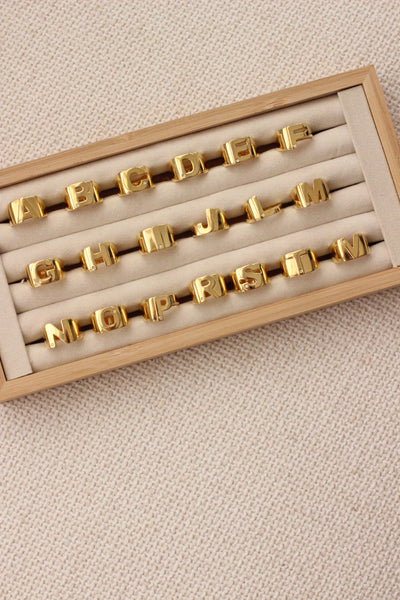 GOLD AND DIAMOND INITIAL SILHOUETTE RING